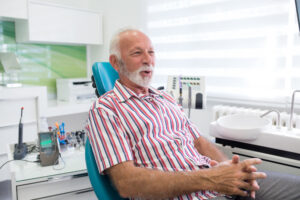 Dentist consulting a patient about a dental implant procedure in a modern clinic.